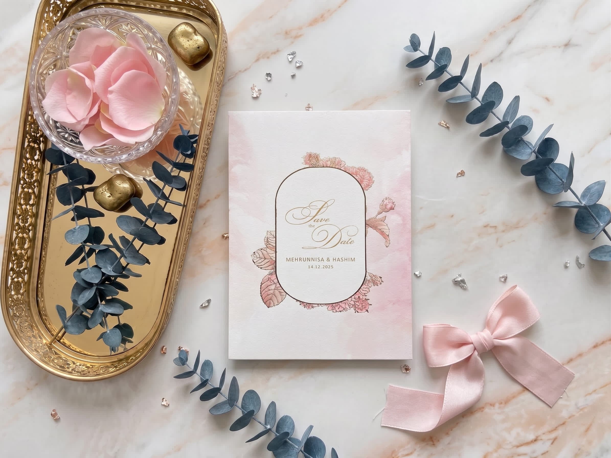 Ivory wedding ceremony card with a gold arch outline and pink peony watercolour florals by Shahi Bulawa Karachi