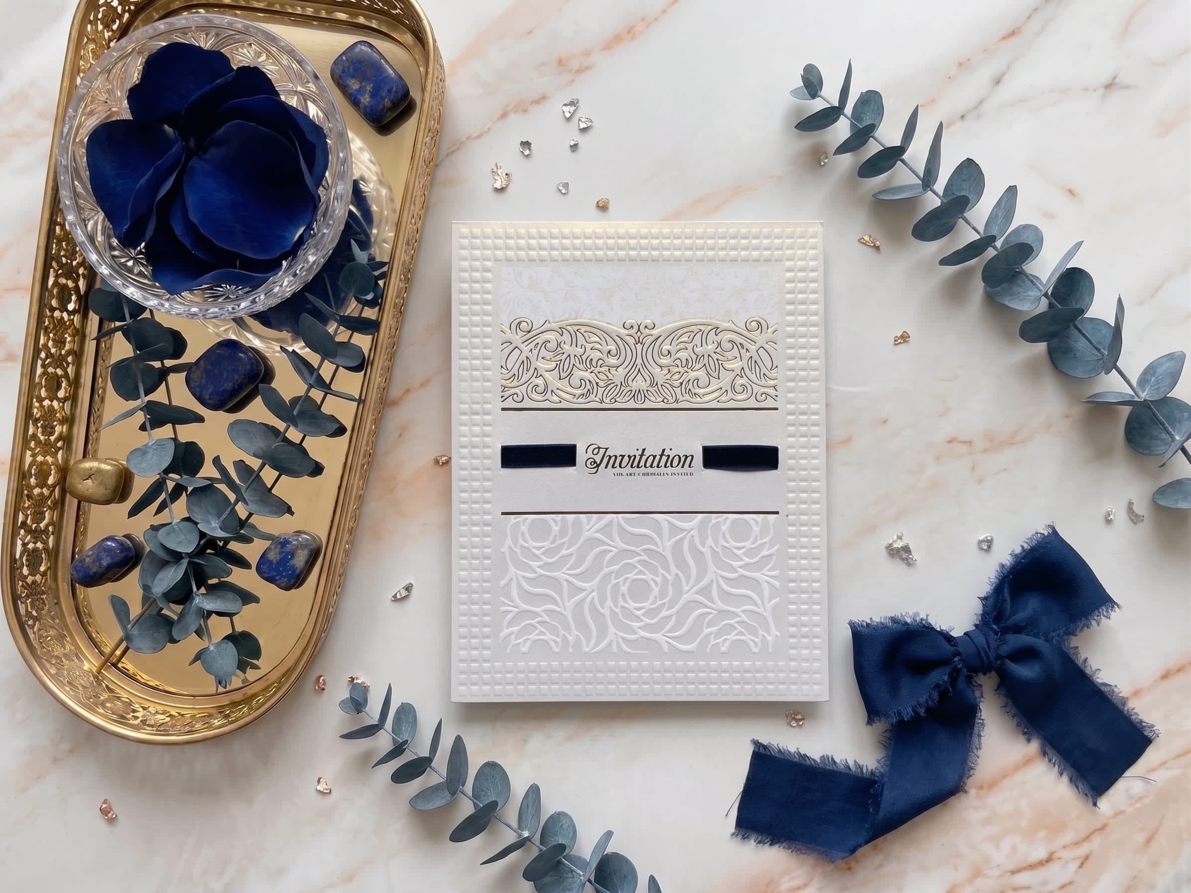 Ivory valima reception card with gold foil calligraphy and an embossed floral border by Shahi Bulawa Karachi