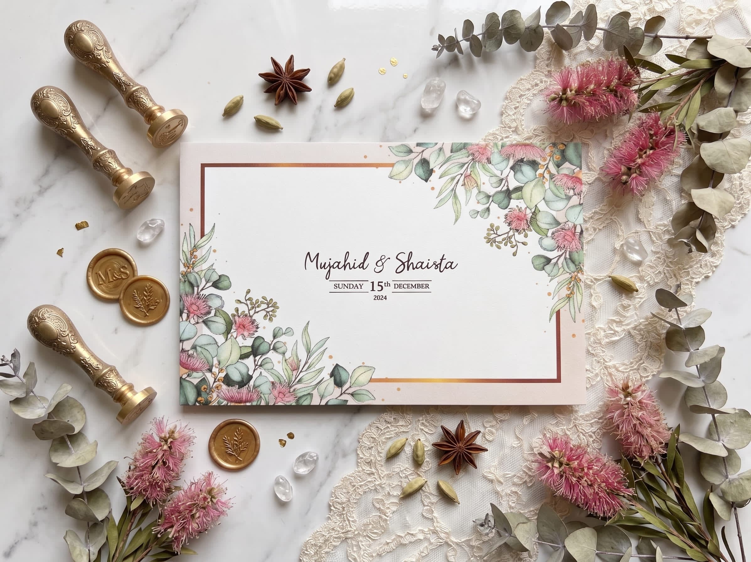 Landscape wedding card with eucalyptus leaves, pink bottlebrush florals and a thin gold frame by Shahi Bulawa Karachi